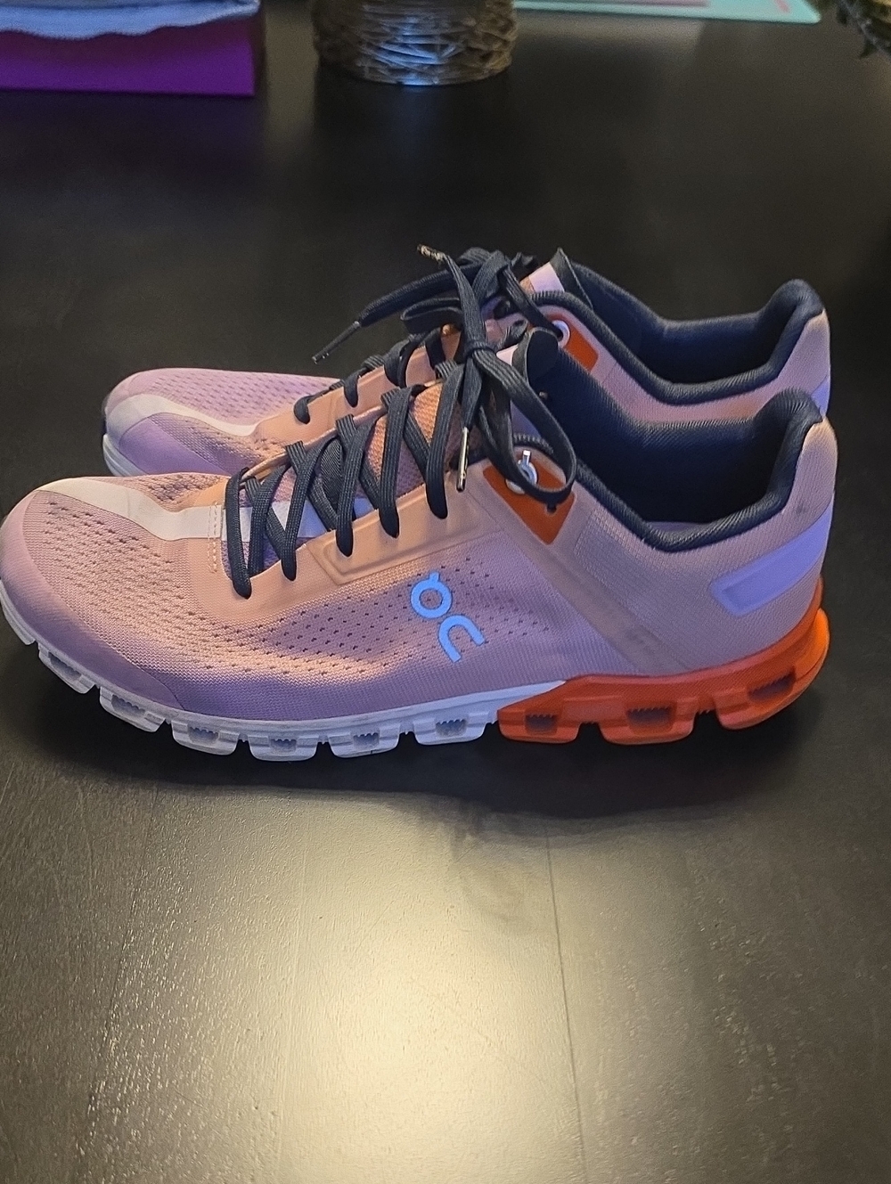 On Running women's athletic shoes in pink with orange sole